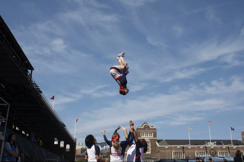Mid-air cheerleading flip